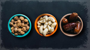 Three bowls of mixed nuts.