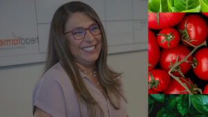 A financial consultant smiles and laughs. Images of vegetables frame the right side of the image, reflecting Headfarmer's cultivation-theme
